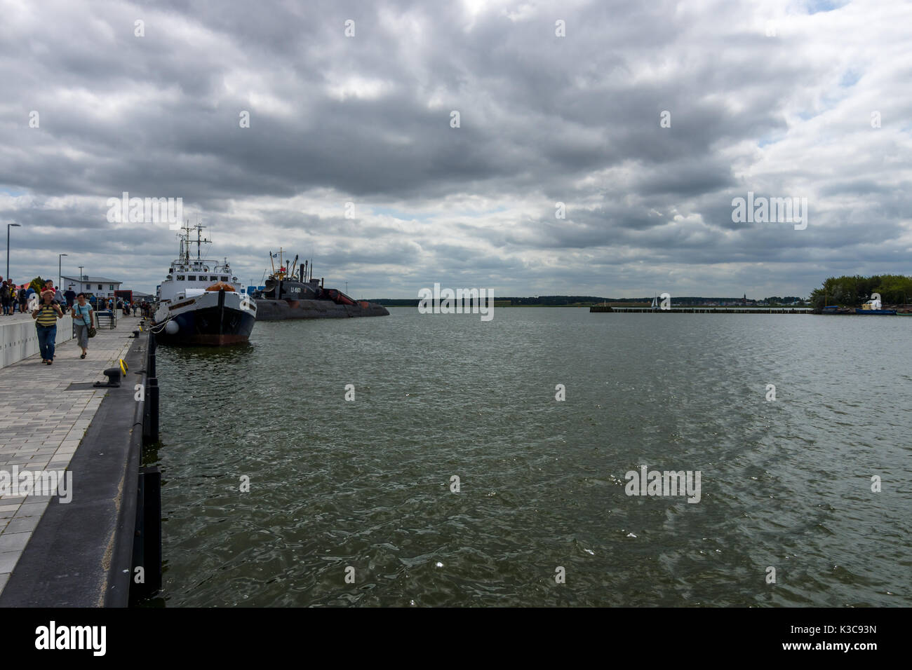 View on Peenemuende seaport on the Baltic Sea island of Usedom. In the background, the Soviet Juliett-class submarine K-24 (U461). Stock Photo