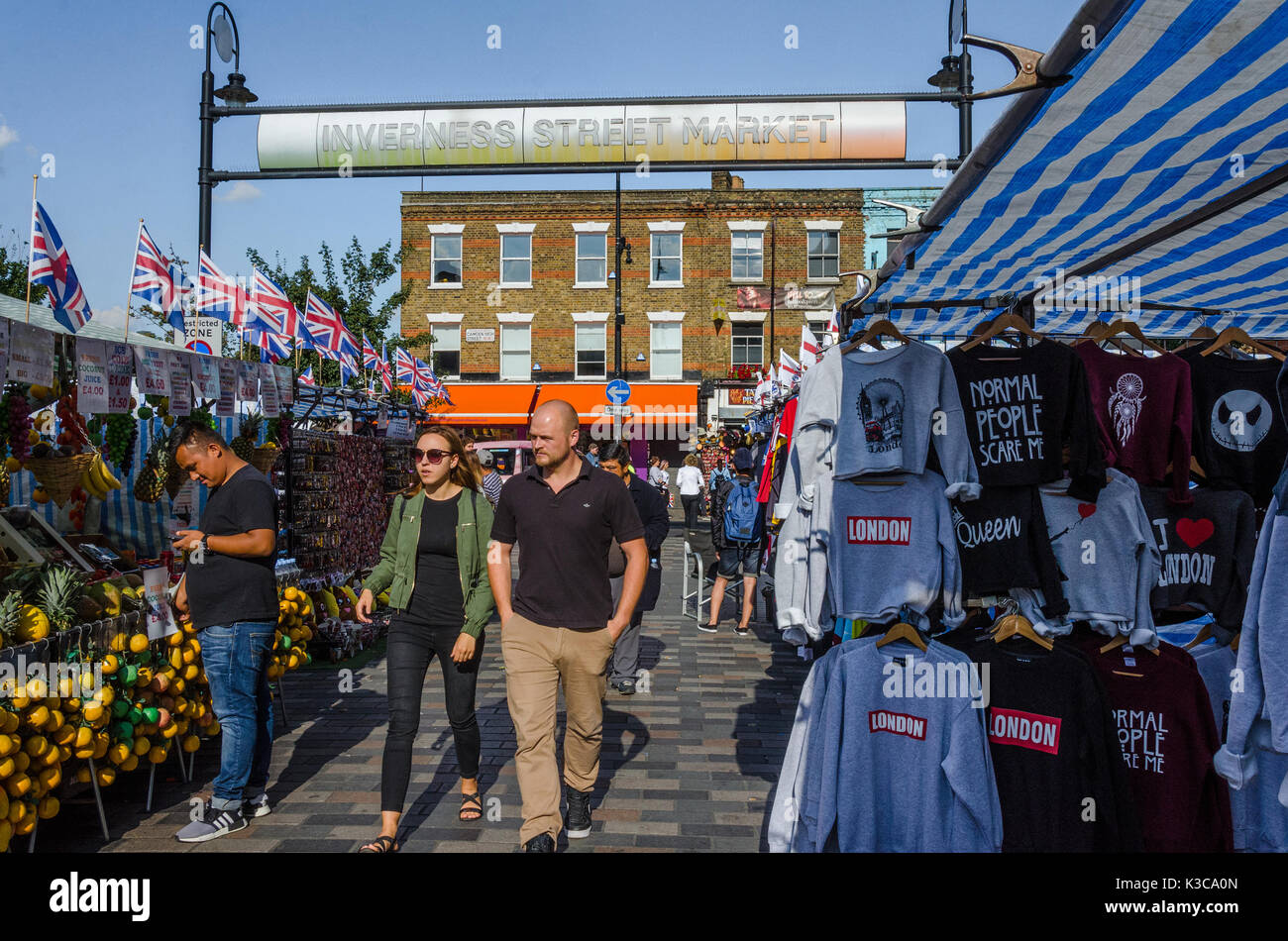 People wander through Inverness Street Market in Camden Town, London. Stock Photo