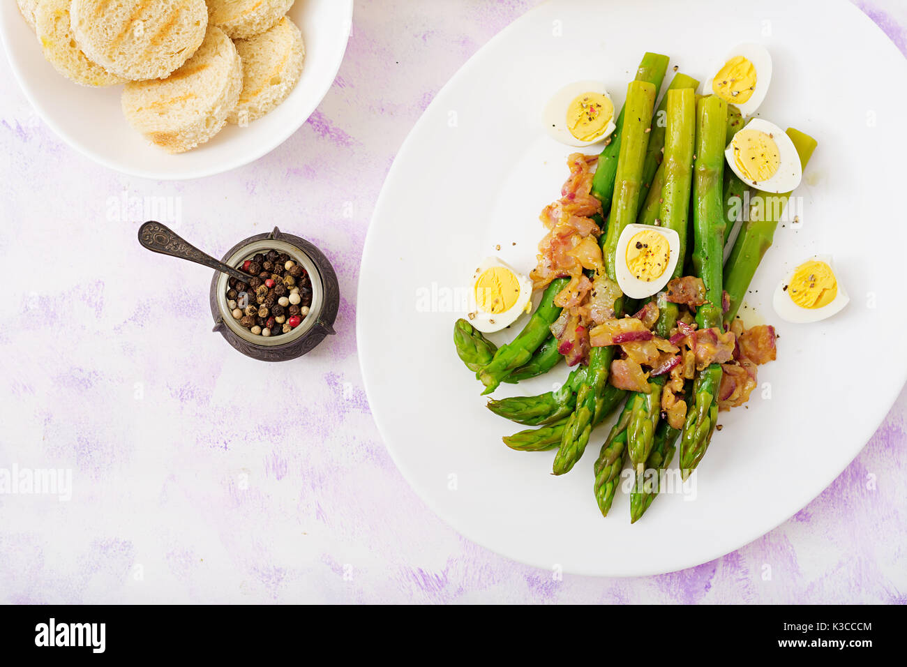 Young shoots of asparagus with ham and quail eggs Stock Photo Alamy