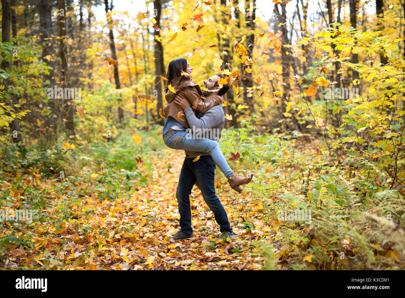 Nice couple having fun in autumn park Stock Photo - Alamy