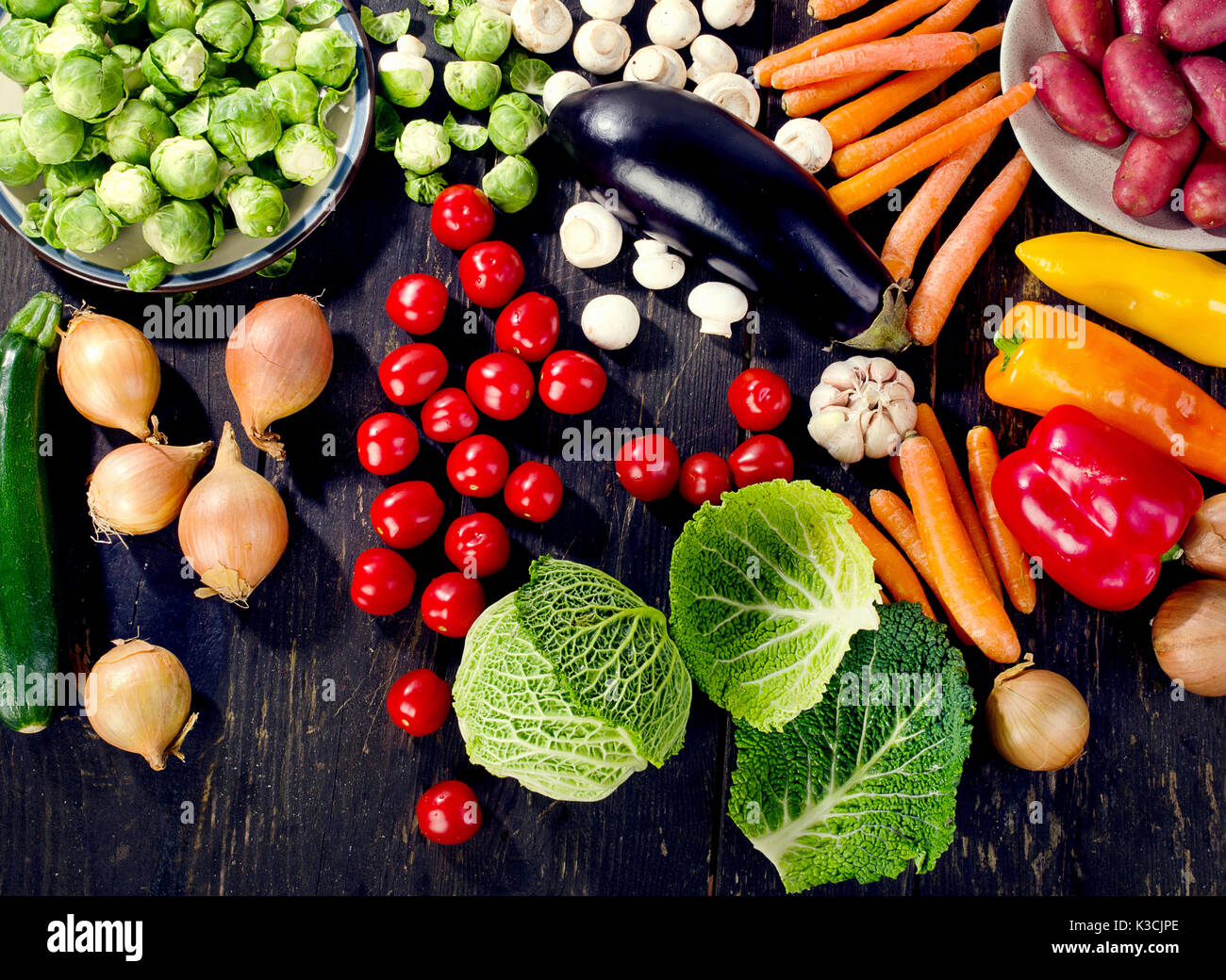 Organic vegetables on rustic wooden table. Healthy eating concept. Top ...