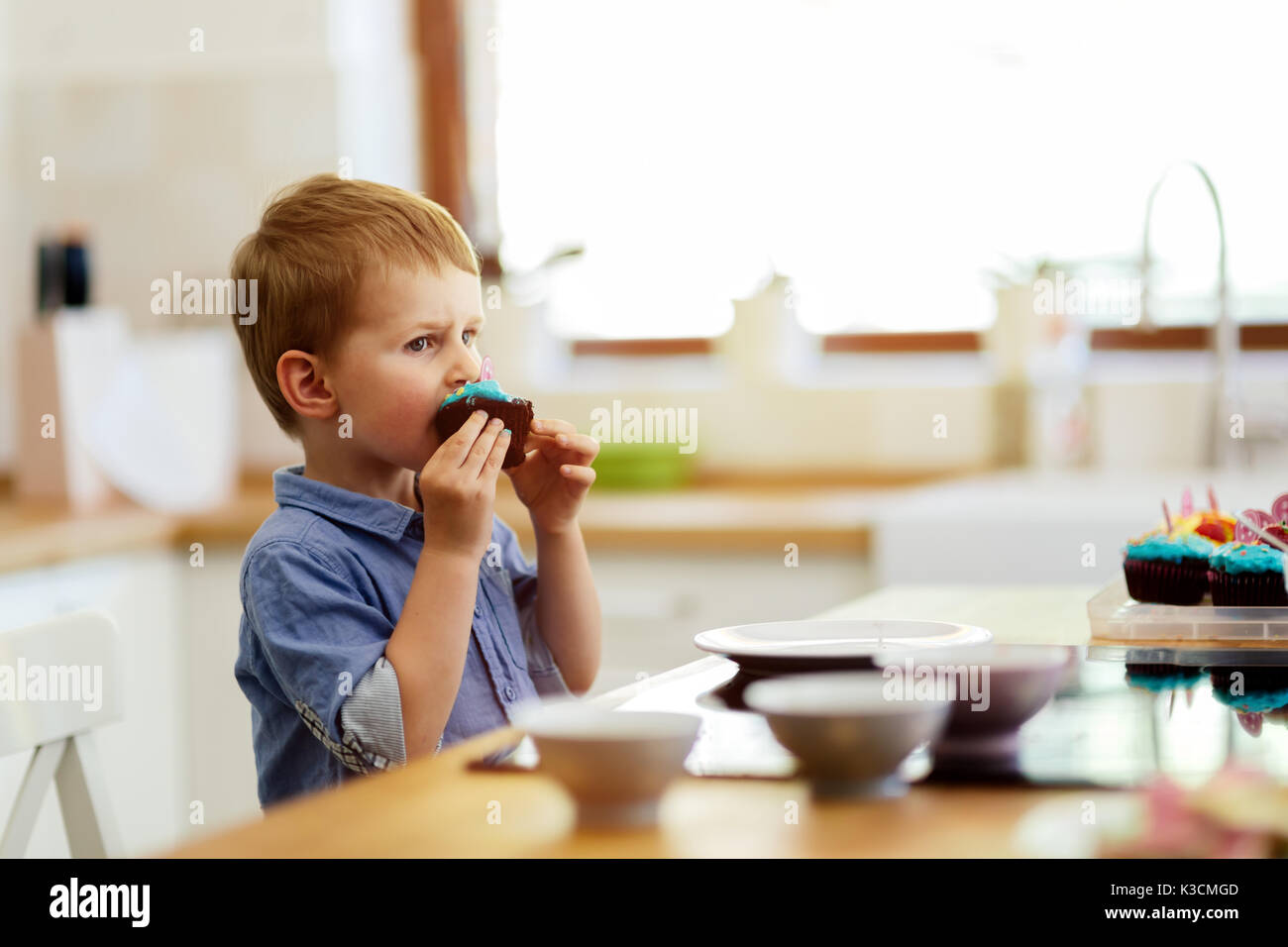cute-child-tasting-cookies-stock-photo-alamy