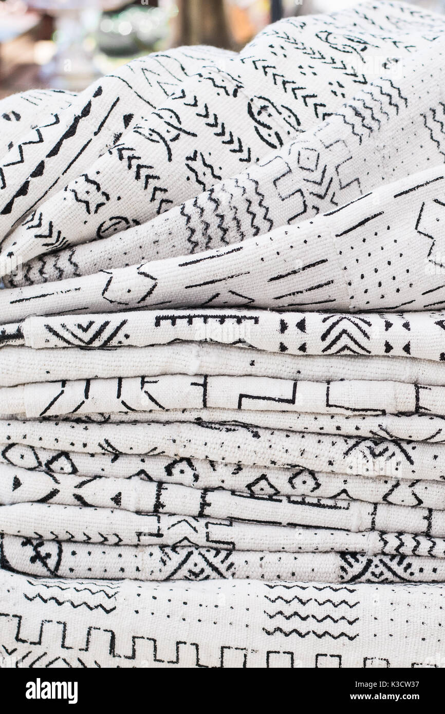 African textiles at a market stall featuring black and white patterns on hand-woven cloth by a woman from Ghana Stock Photo