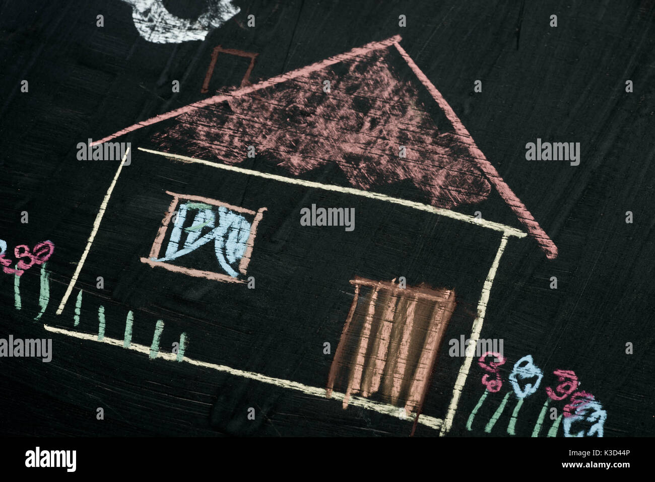 house chalk drawing on blackboard background selective focus macro