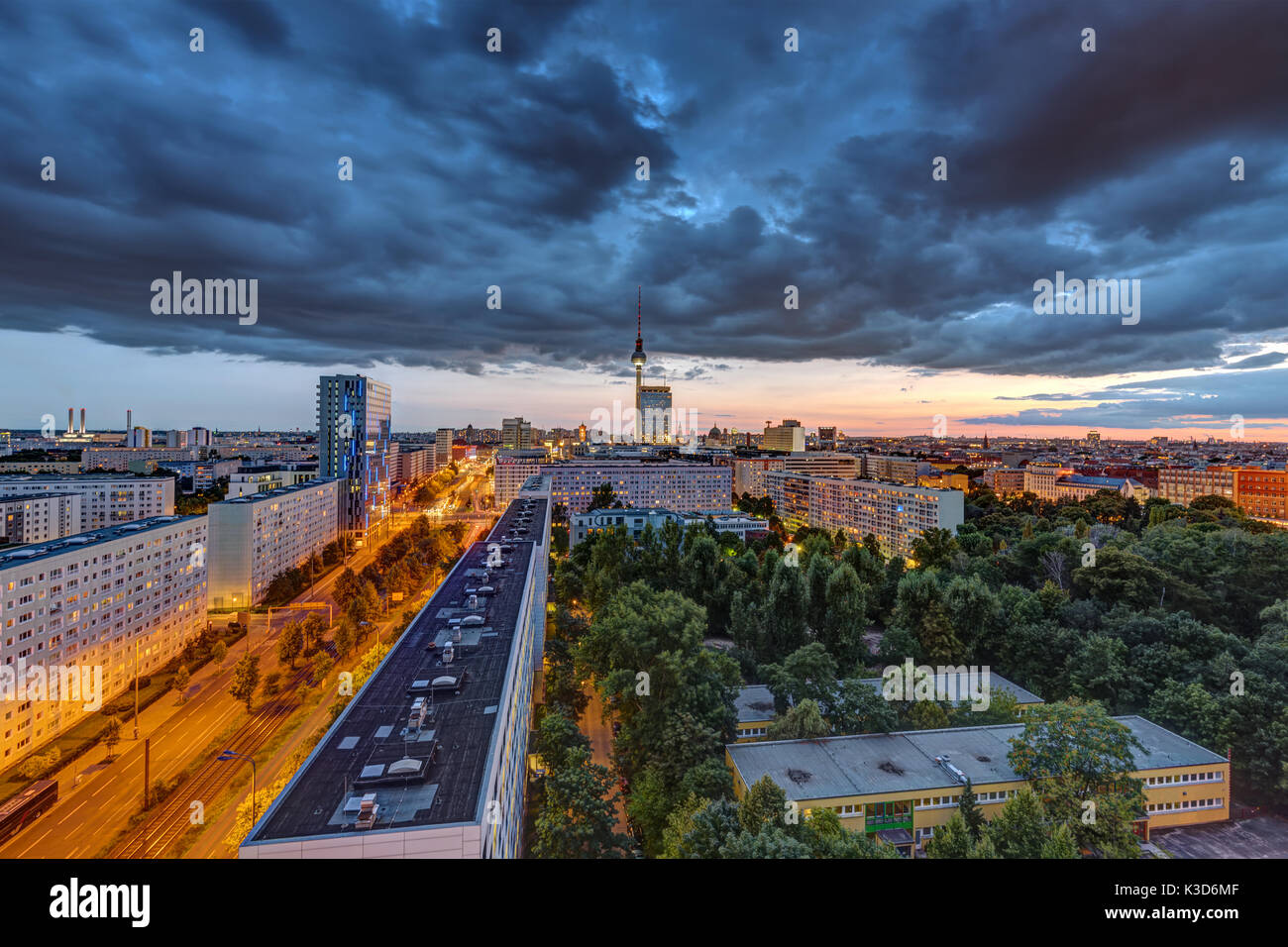 Dark clouds over the berlin television tower hi-res stock photography ...