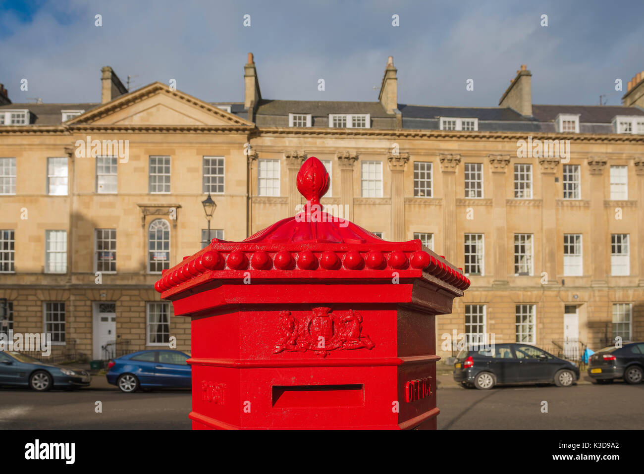 Bath UK city, a vivid red Georgian pillar box in Great Pulteney Street, Bath, Somerset, England. Stock Photo