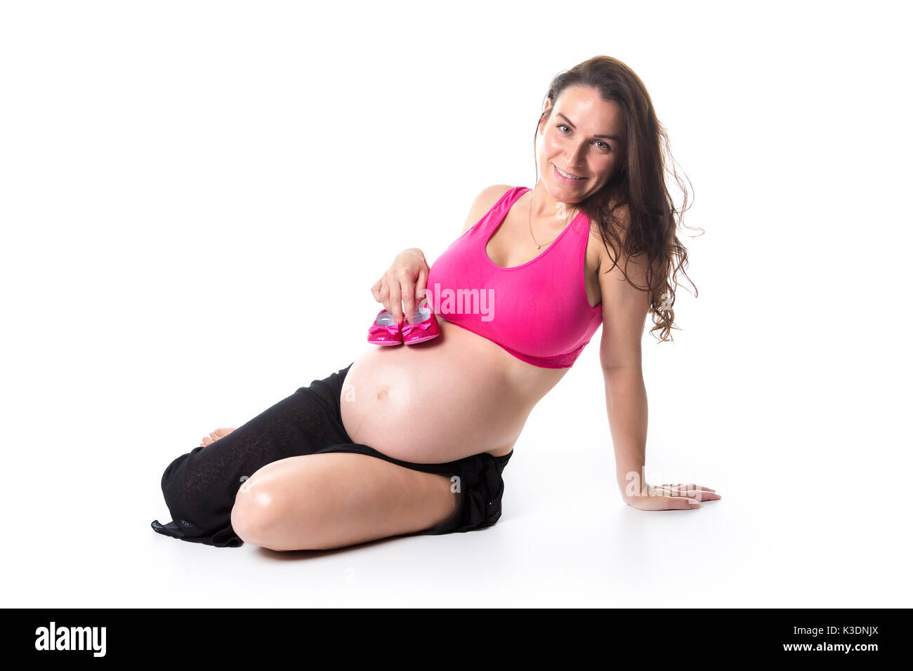 pregnant woman belly over white background Stock Photo