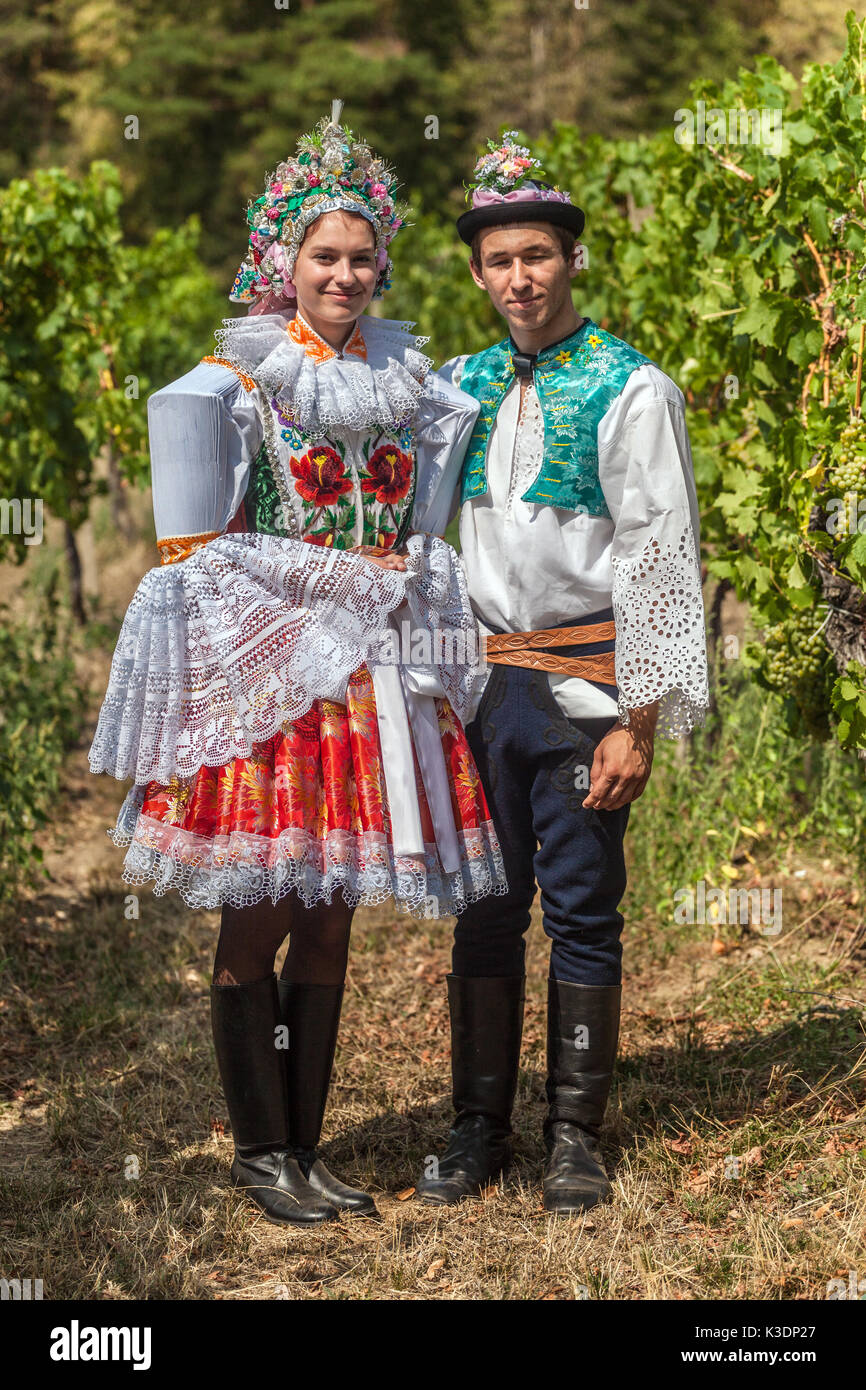 Southern Moravia, Czech Republic costume couple wearing folk costumes in the vineyard, Moravian folklore traditional dress Czech folk costume Stock Photo