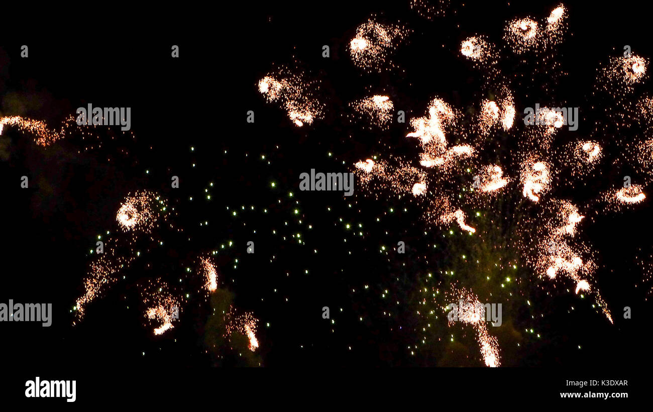 Coloured fireworks in the night sky, Stock Photo