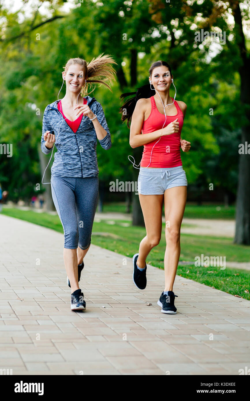 Women jogging in park hi-res stock photography and images - Alamy