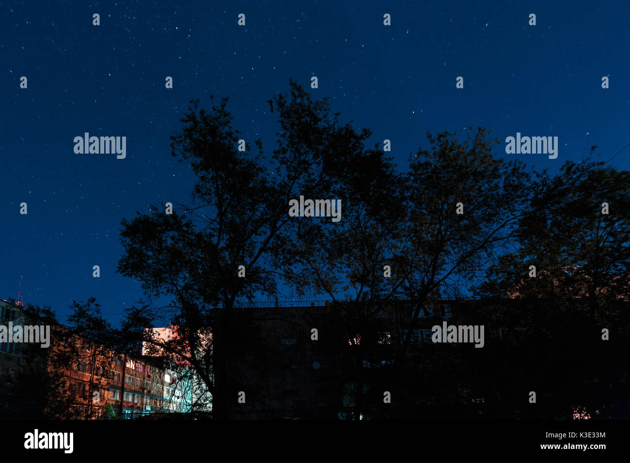 Starry night sky over houses in Yerevan Armenia Stock Photo