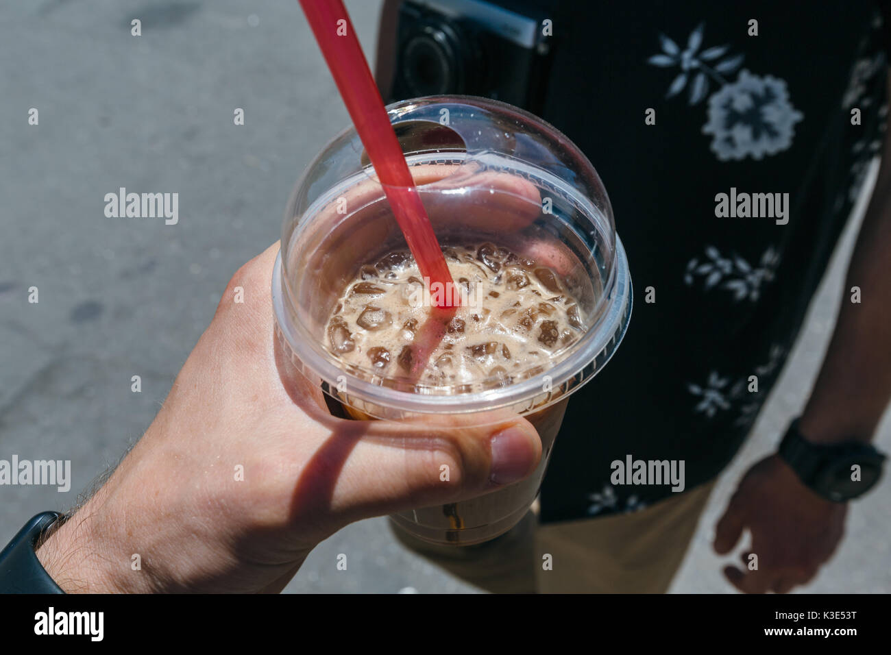 https://c8.alamy.com/comp/K3E53T/coffee-with-ice-in-hand-K3E53T.jpg