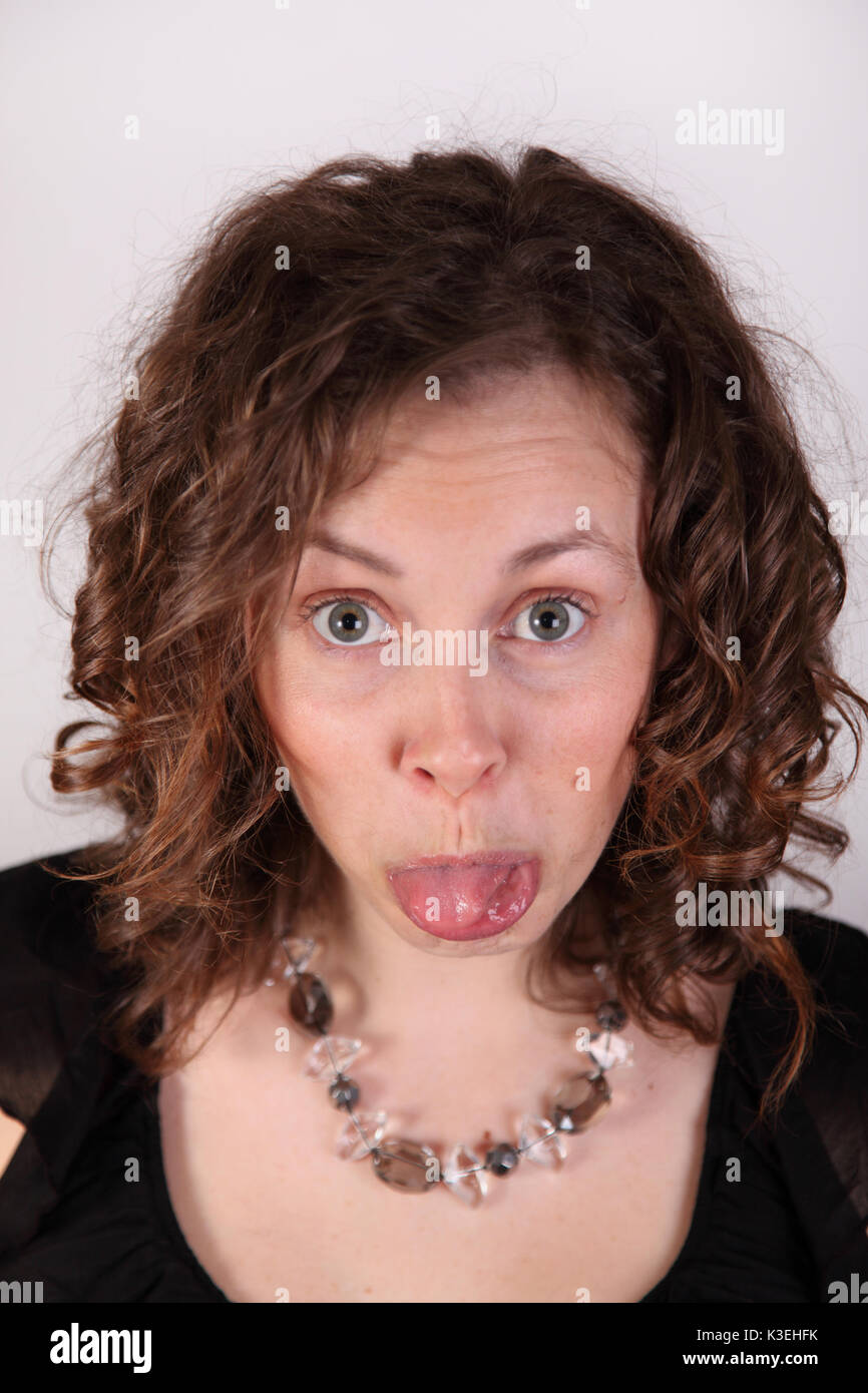 woman sticks out tongue Stock Photo