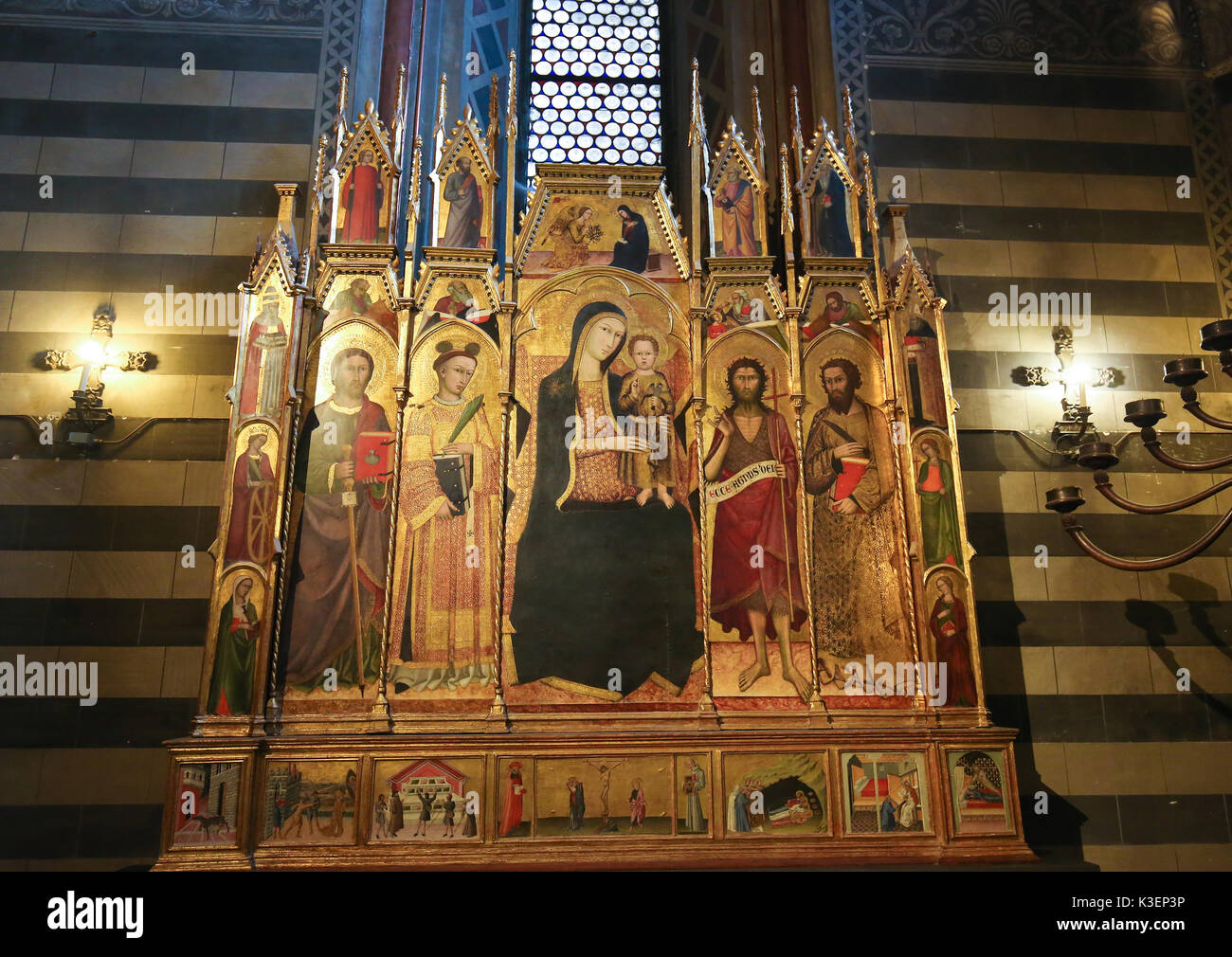 14th Century Polyptich by Andrea Vanni in the Siena Baptistery of San Giovanni at the Cathedral of Siena, depicting Mother Mary, Saints James the Grea Stock Photo