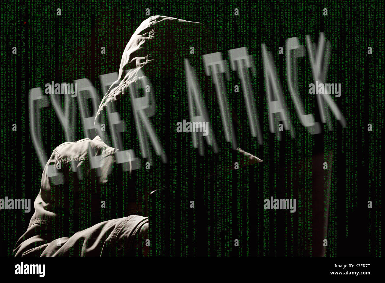 hacker silhouette with matrix code Stock Photo