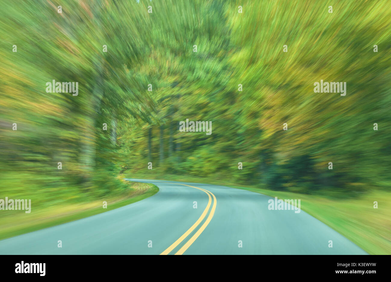 A camera panning technique to mimic the driving motion on the road in Shenandoah National Park, Virginia. Stock Photo