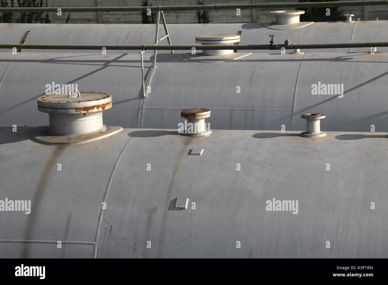 Huge gas storage tanks in an industrial area. Large cylinders are used