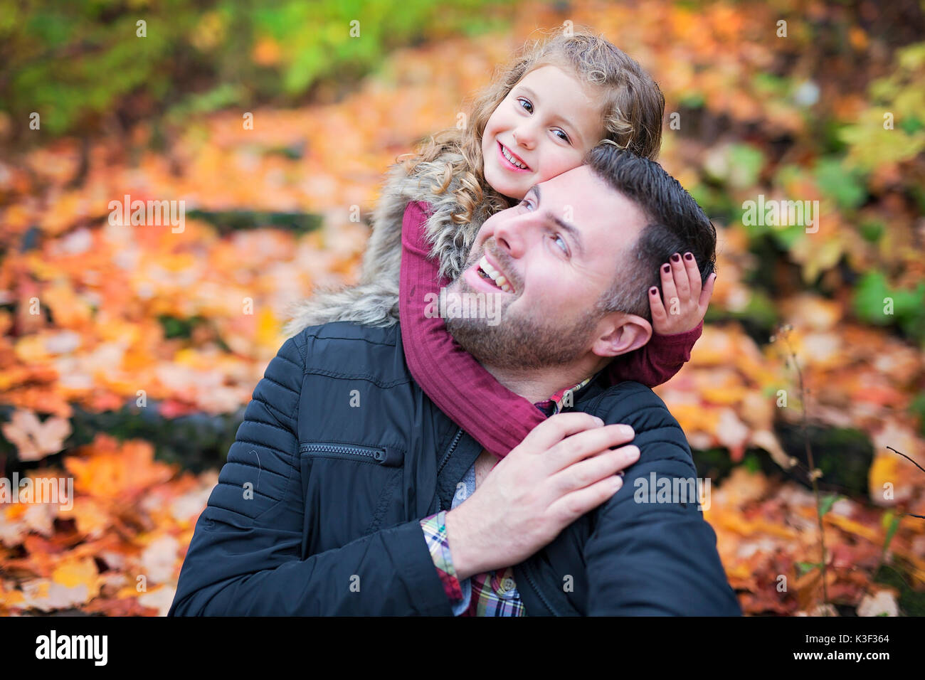 Little adorable girl with happy father in autumn park outdoors Stock ...