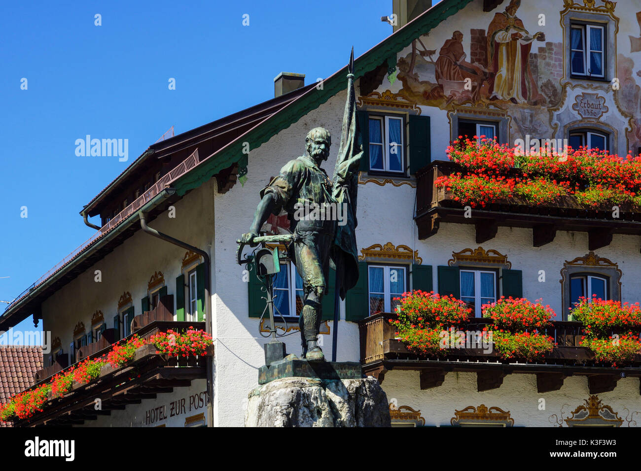 Smith of Kochel monument in front of the inn 'Zur Post', Kochel am See, Upper Bavaria, Bavaria, Germany Stock Photo