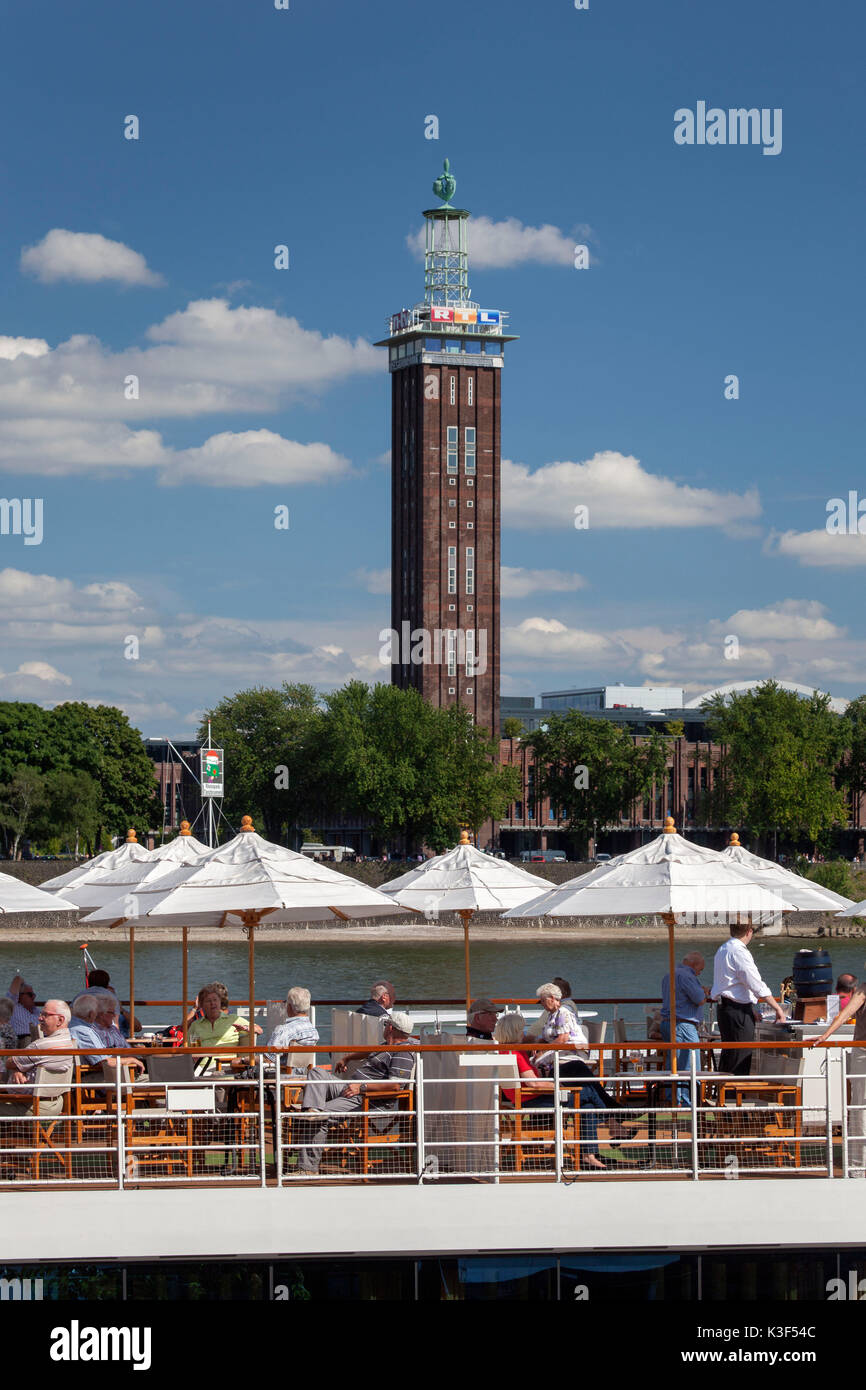 Holiday ship on the Rhine River in front of RTL tower and KölnTriangle, Cologne, North Rhine-Westphalia, Germany Stock Photo