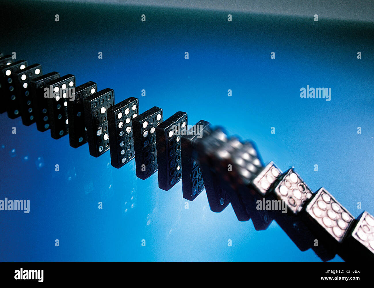 Series of dominos falling Stock Photo