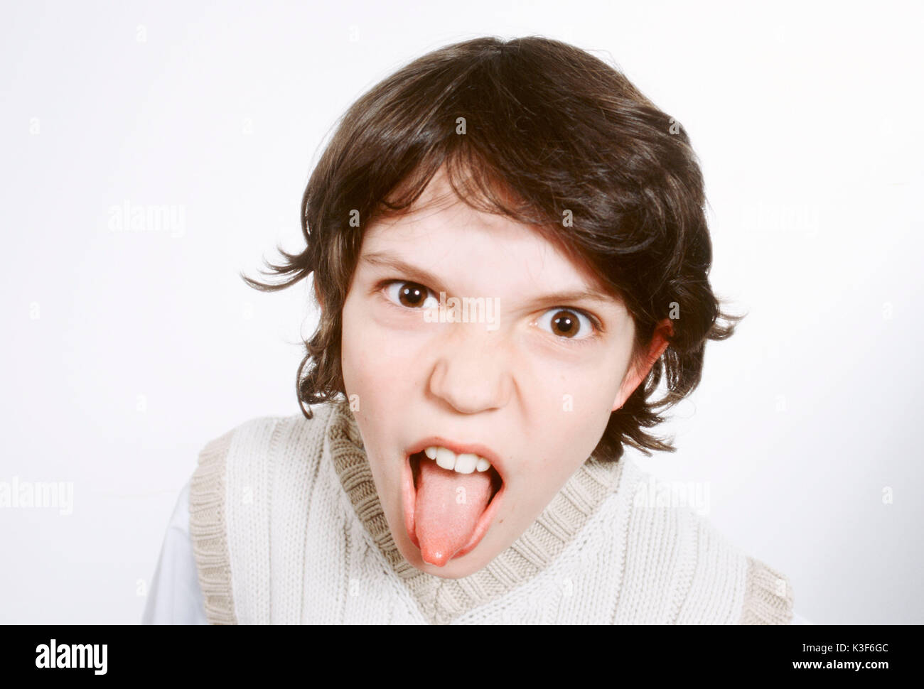 Boy sticks out tongue Stock Photo