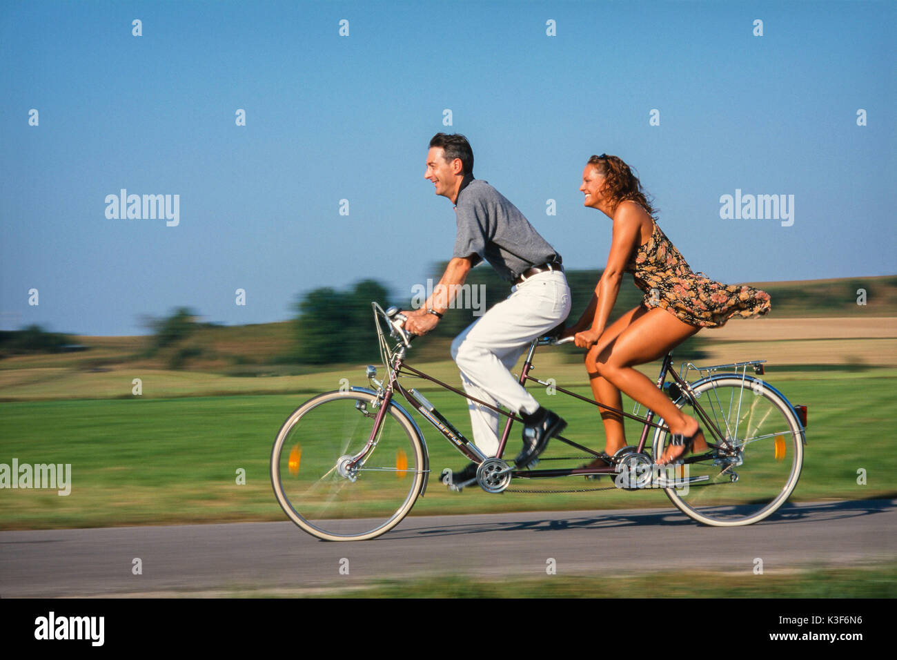 Two women on tandem bicycle hires stock photography and images Alamy