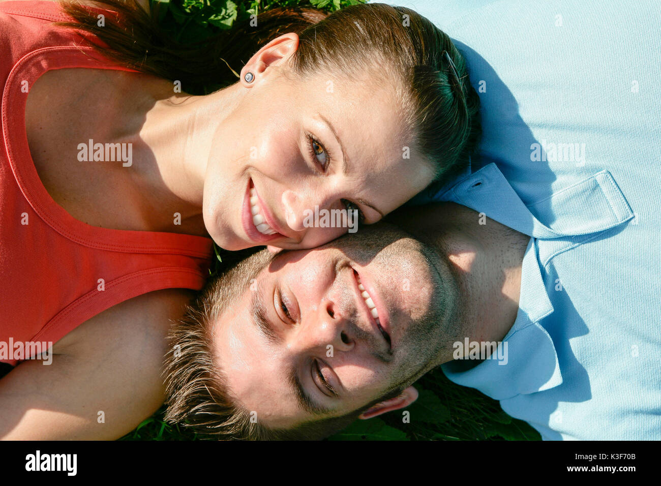 Young couple lies side by side closely packed Stock Photo