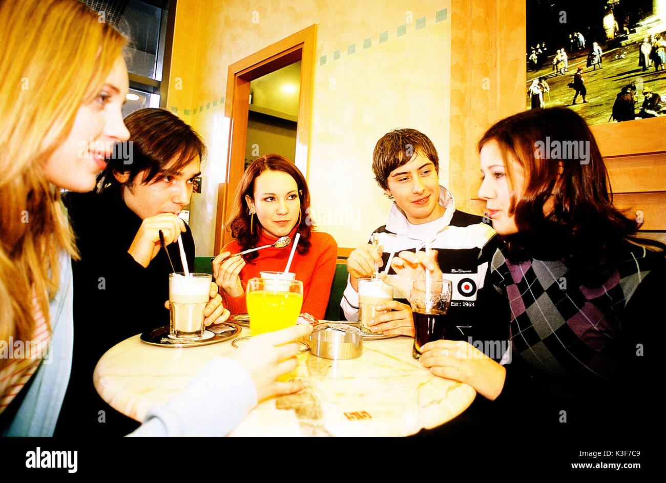 Group of young persons at the cafe Stock Photo