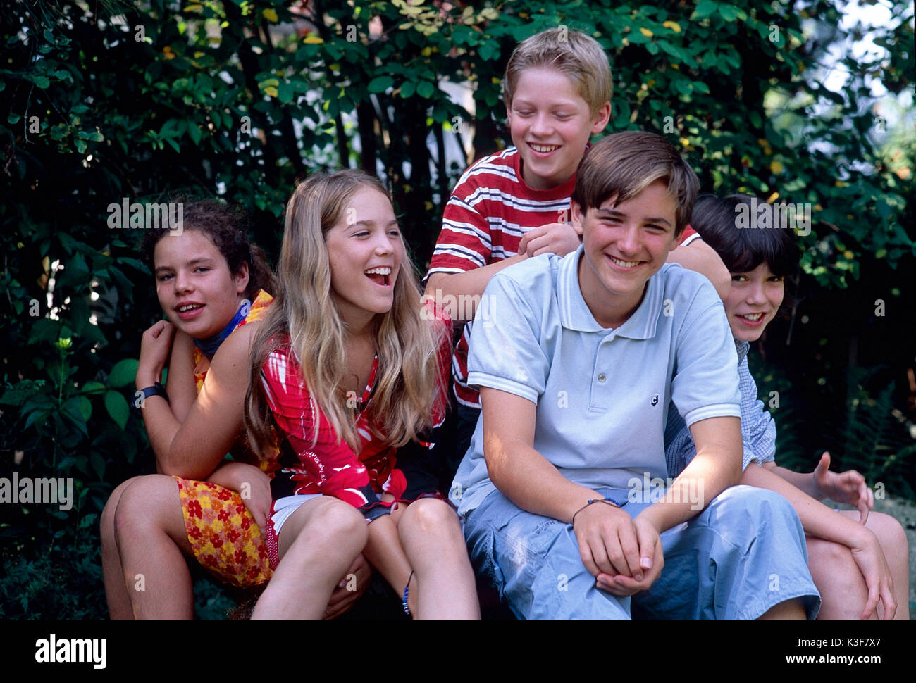 Group laughing at girl hi-res stock photography and images - Alamy