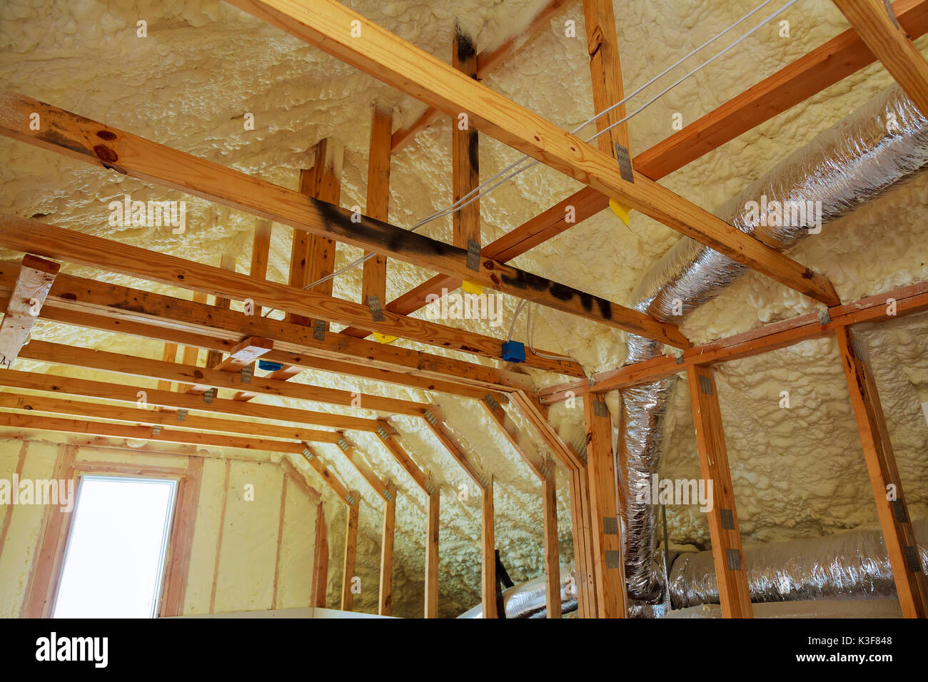 thermal and hidro insulation Inside wall insulation in wooden house, building under construction Stock Photo