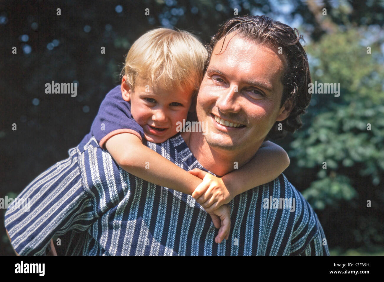 father with son on back Stock Photo