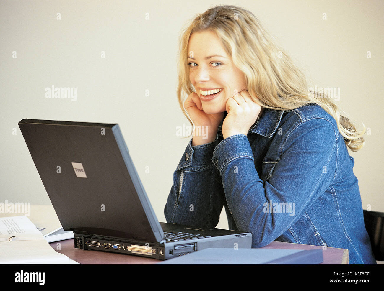 Laughing young woman with the laptop Stock Photo