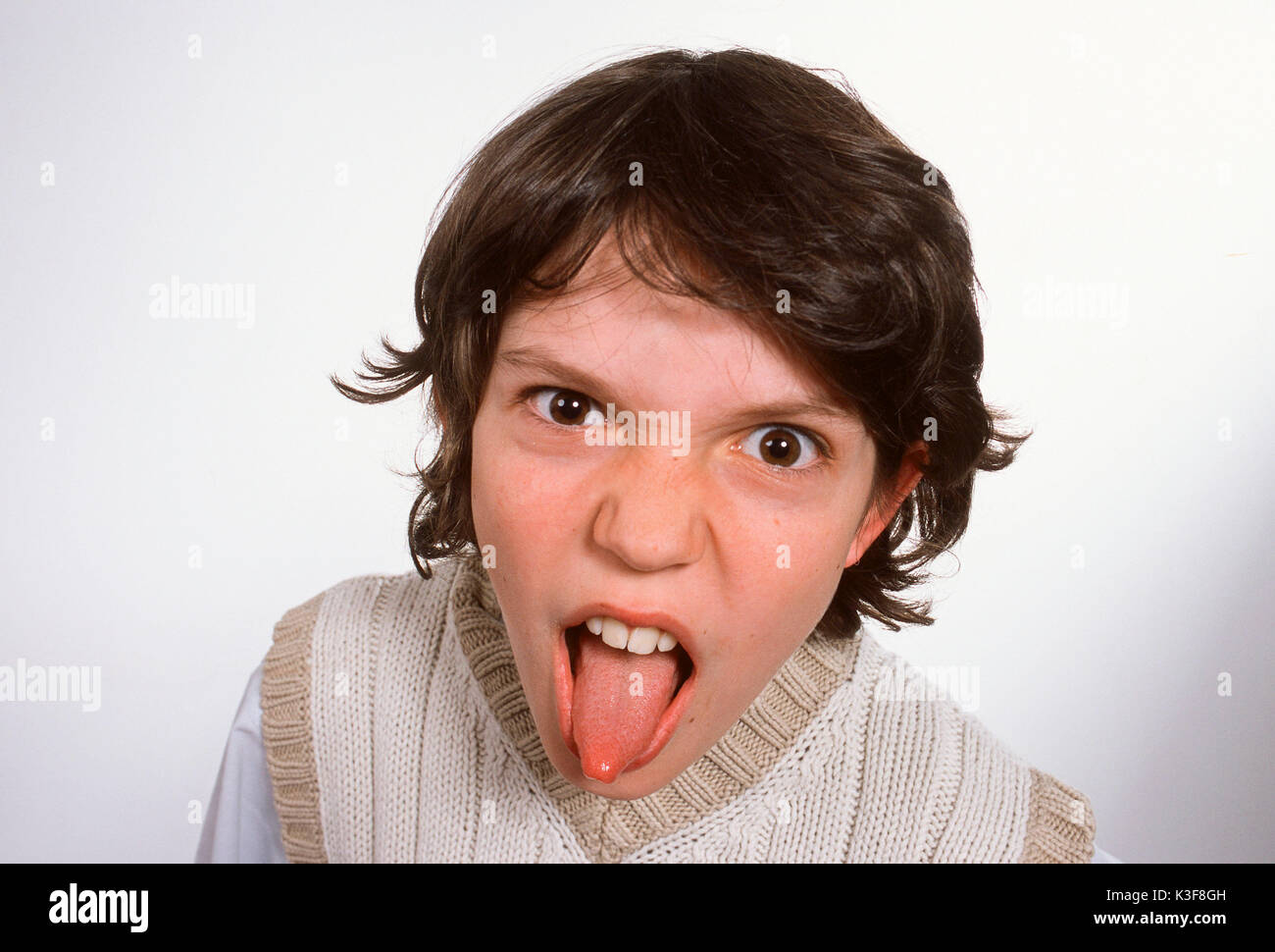 Boy sticks out tongue Stock Photo