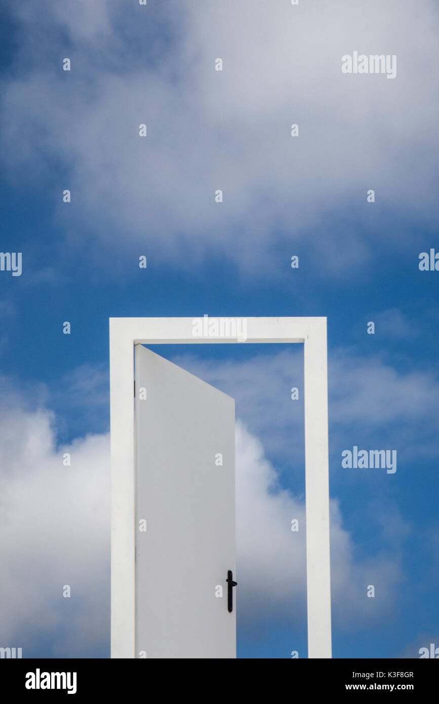 Open Door to Blue Sky and Clouds Stock Photo - Alamy