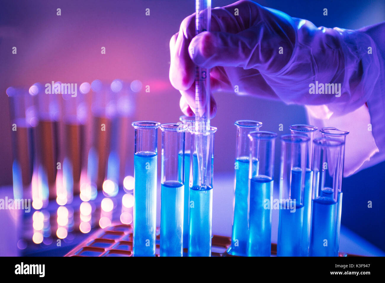 blody fluid harvesting from test tube at the laboratory Stock Photo