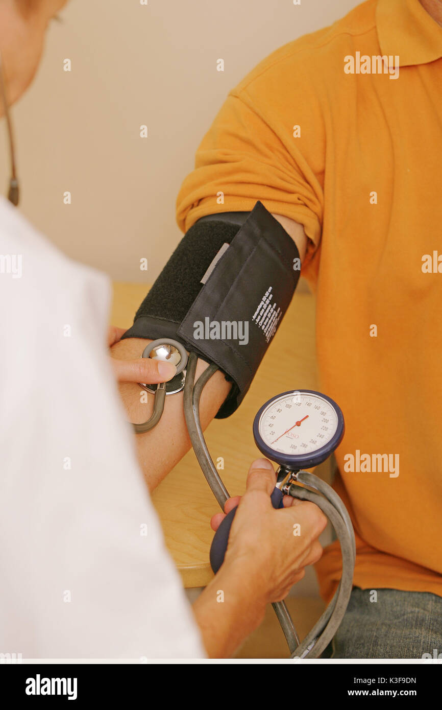 Visit man blood pressure measurement hi-res stock photography and ...