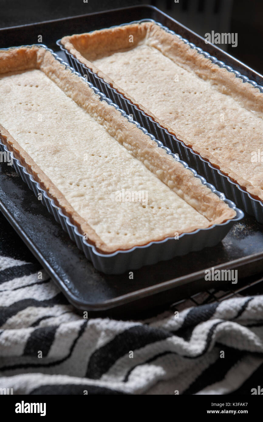 Two Tart Trays with Pastry Crust Stock Photo