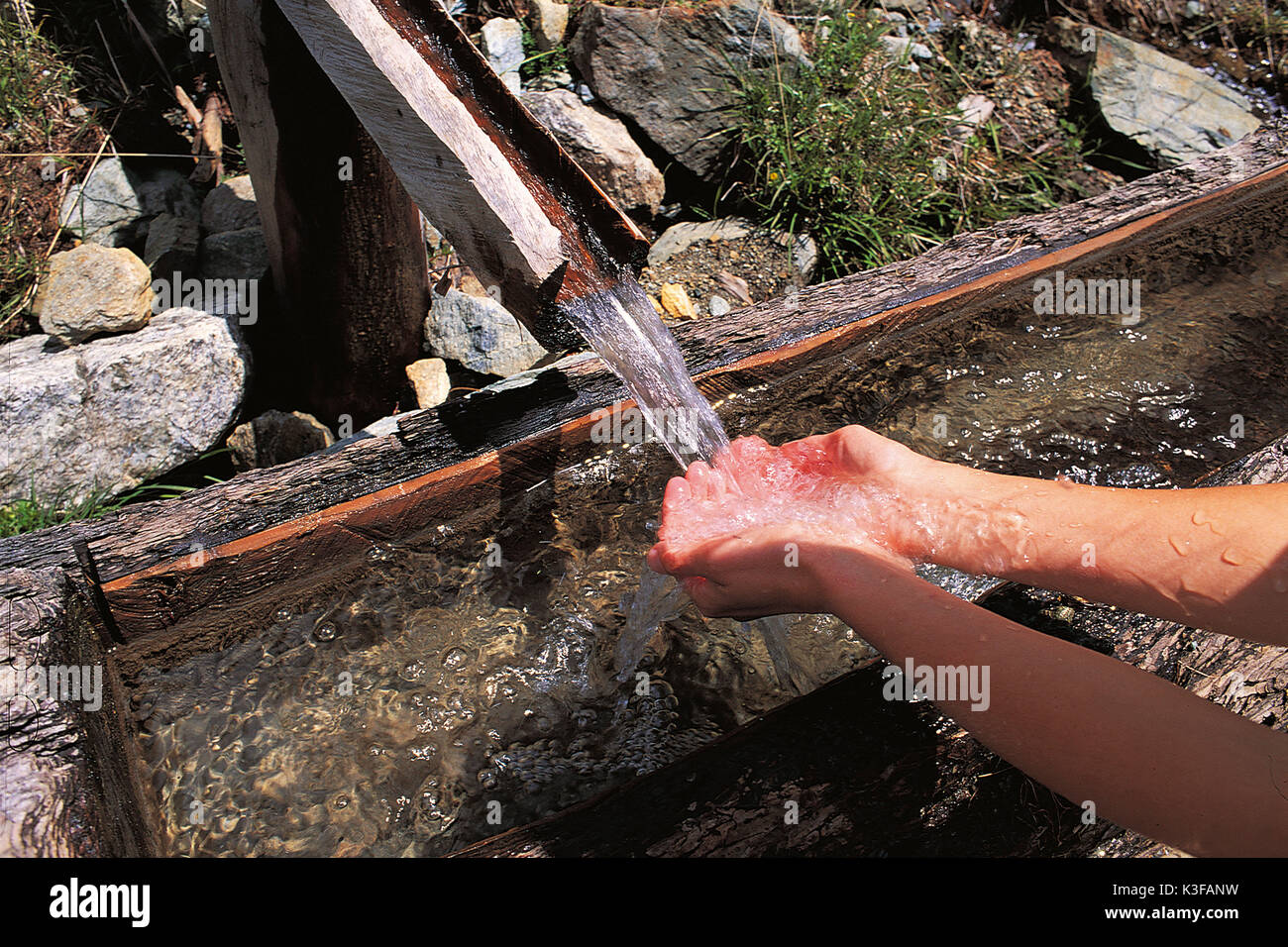 Hands catch water from a well Stock Photo Alamy