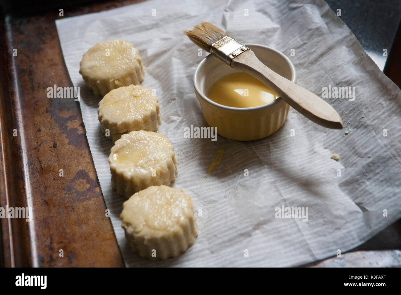 Brushing Homemade Country Biscuits with Butter Stock Photo Alamy