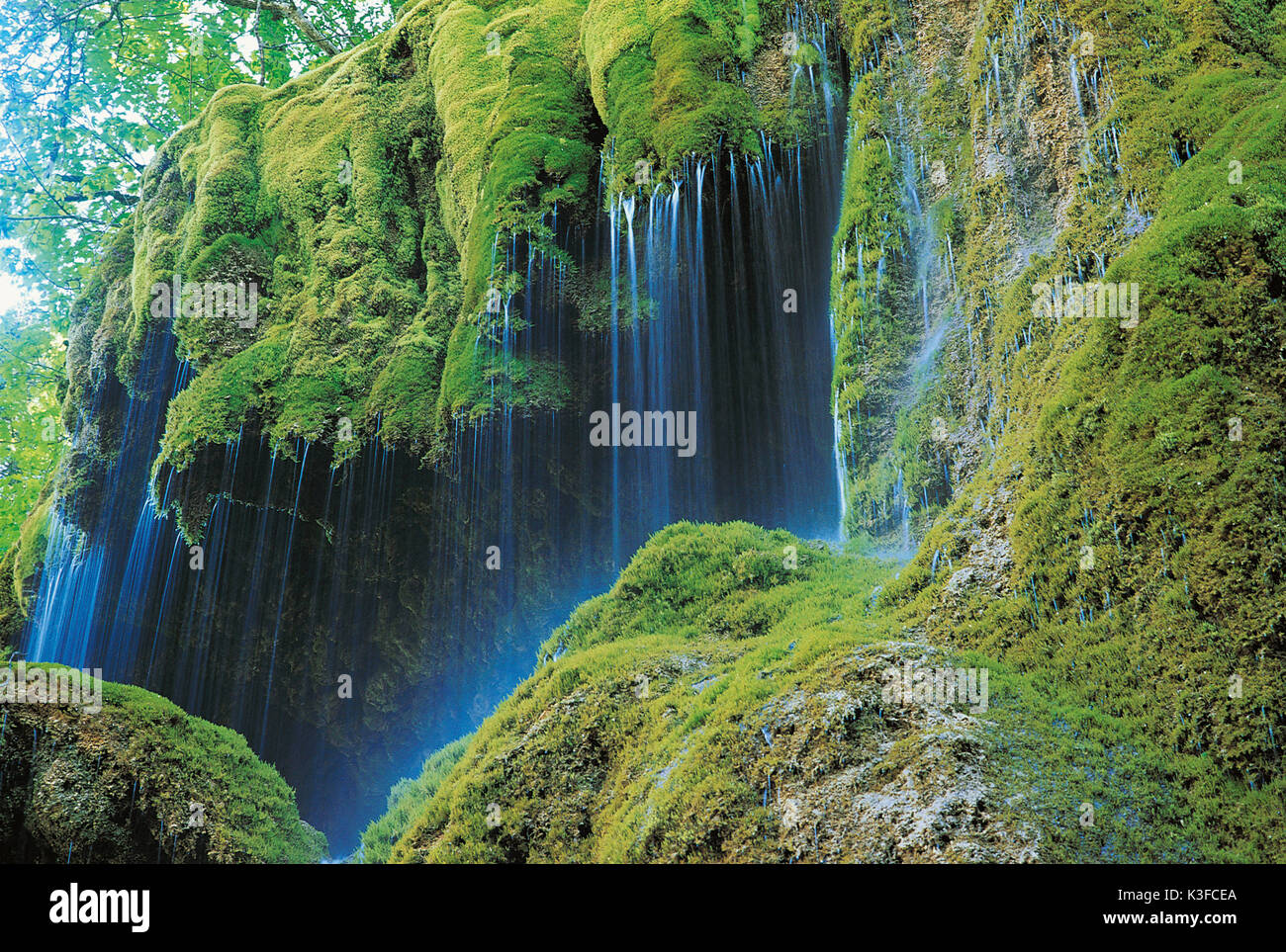 Veil waterfall on mossyem stone Stock Photo