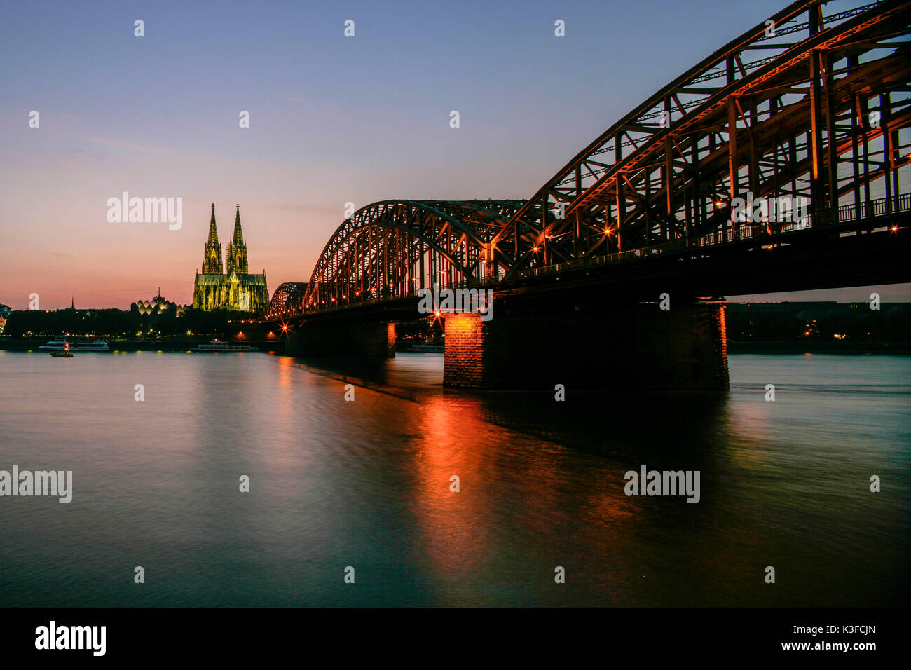 Cologne Cathedral and Hohenzollernbrücke in the evening light Stock Photo