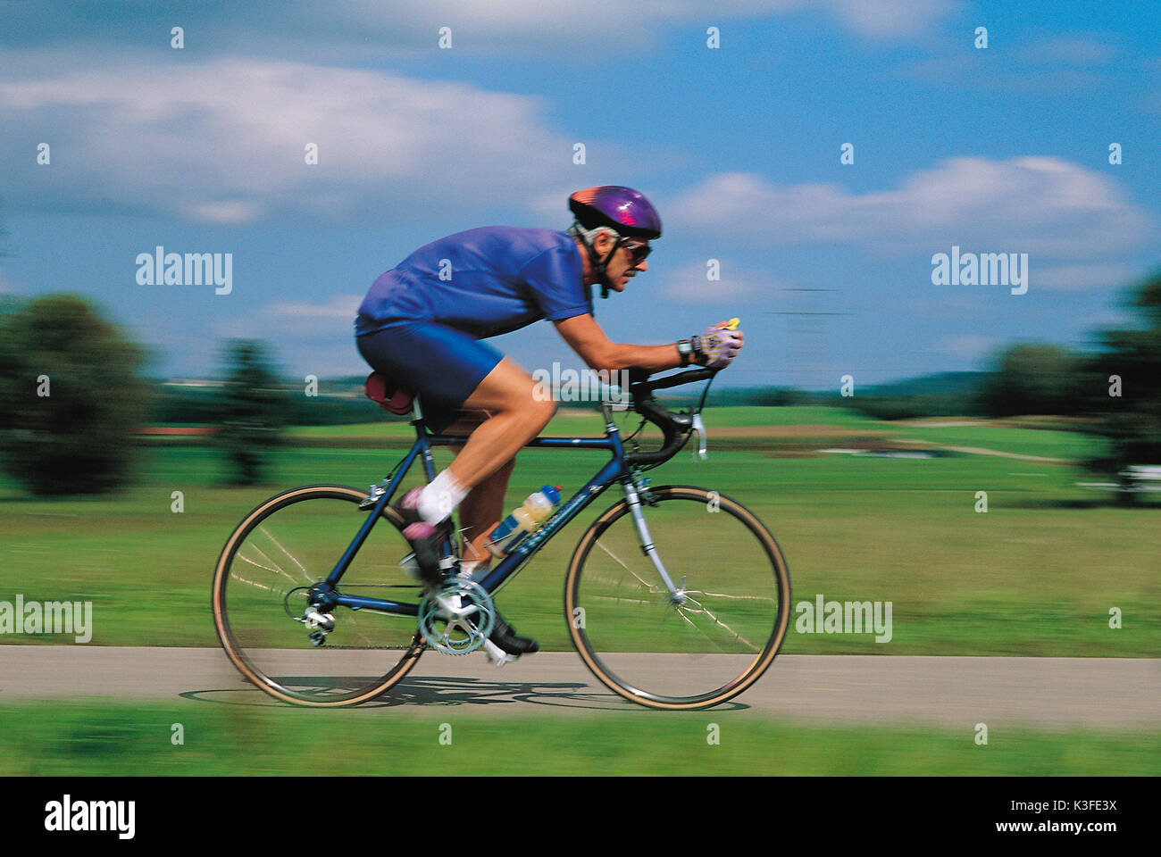 Racing cycle sportsman on bicycle Stock Photo
