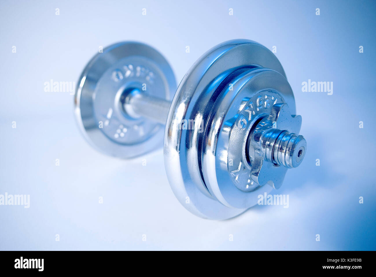 Exercise with dumb-bells Stock Photo