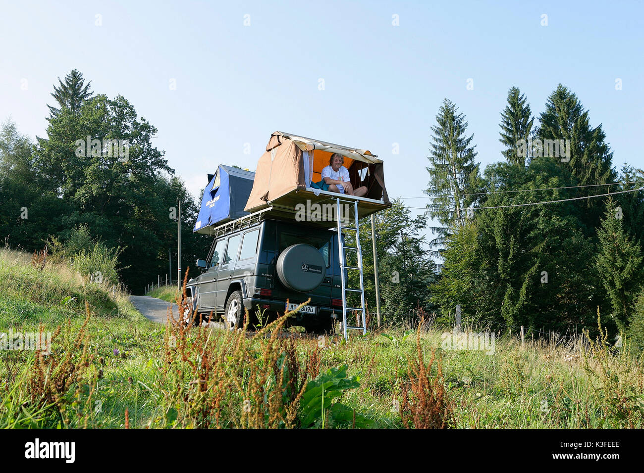 Roof tent on sport utility vehicle Stock Photo