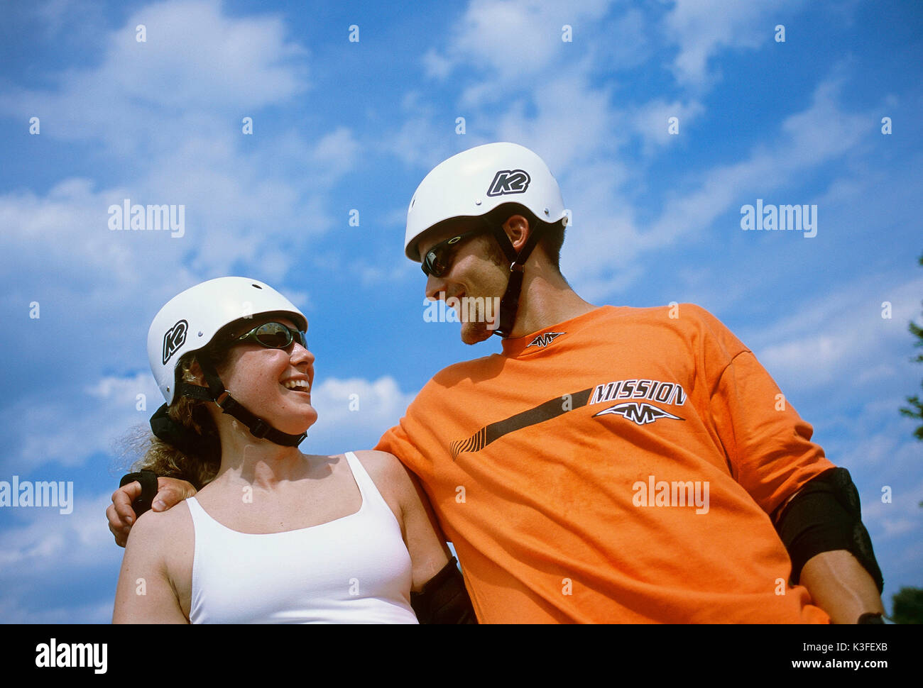 sportsman couple with helmet Stock Photo