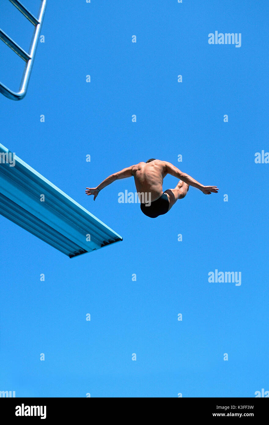 Tower jumper jumping of the springboard Stock Photo