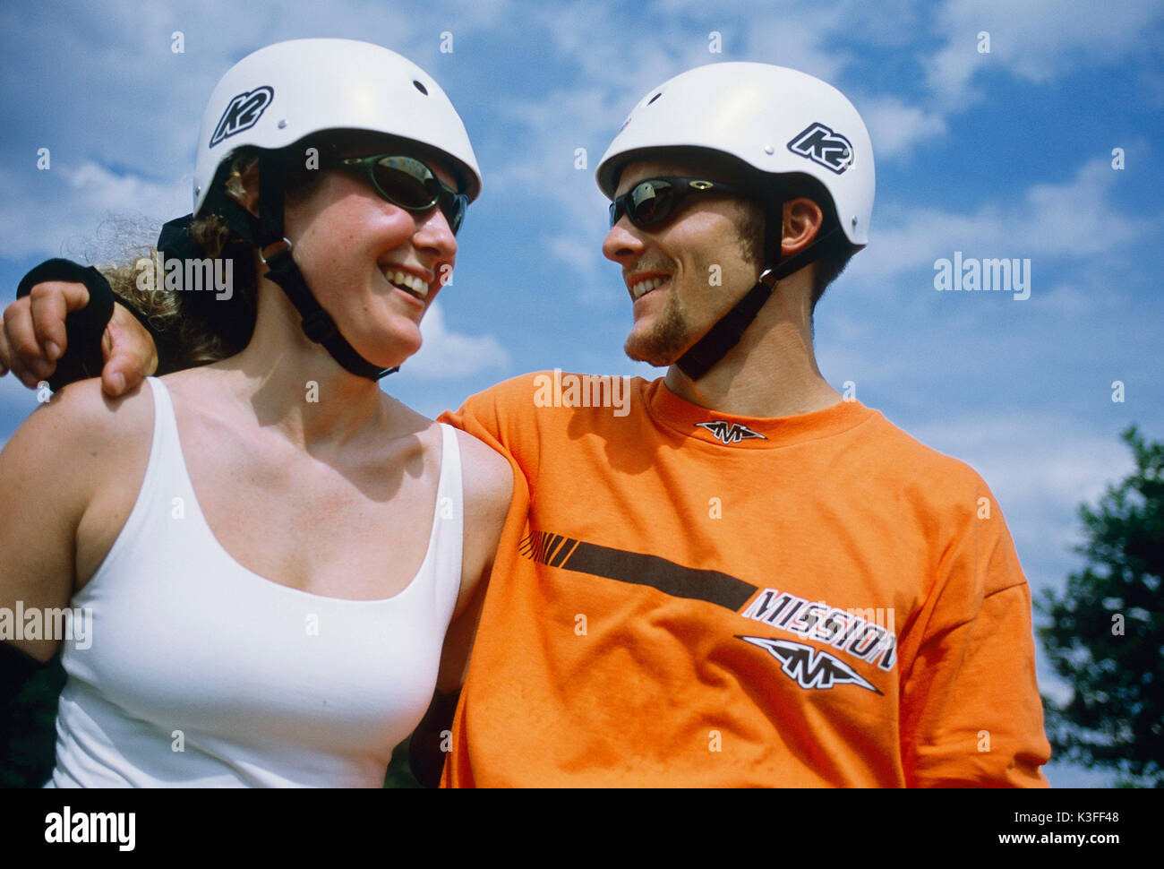 sportsman couple with helmet Stock Photo