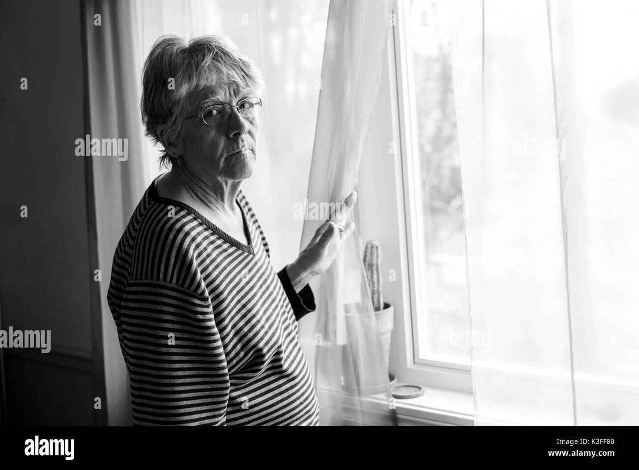 Elderly woman sad Black and White Stock Photos & Images - Alamy