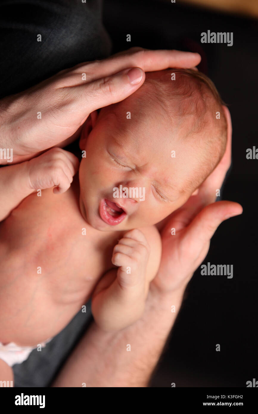 yawning or crying baby Stock Photo Alamy